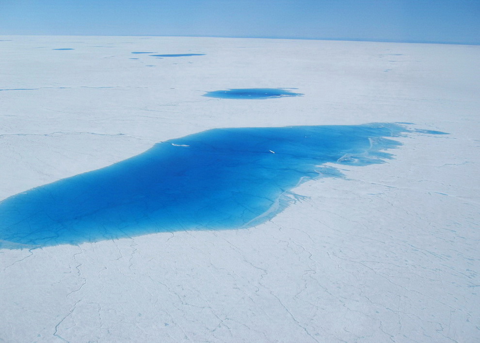 The "North Lake" was the first site that was selected in 2006 for the deployment of scientific instruments for measuring changes in ice motion caused by melt water reaching the base of the ice sheet. The lake is only partially full in this picture. When entirely full, the lake was nearly 4-km (2.5 miles) wide and more than 40 feet deep. The entire lake drained in about 90 minutes 16 days after this picture was taken.