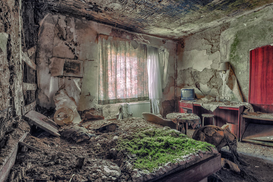 abandoned decay bedroom with chair table tv in a hotel