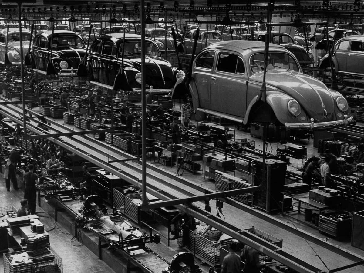 26th September 1956: A production line manufacturing Volkswagen Beetles at the factory in Wolfsburg, West Germany. (Photo by Keystone Features/Getty Images)