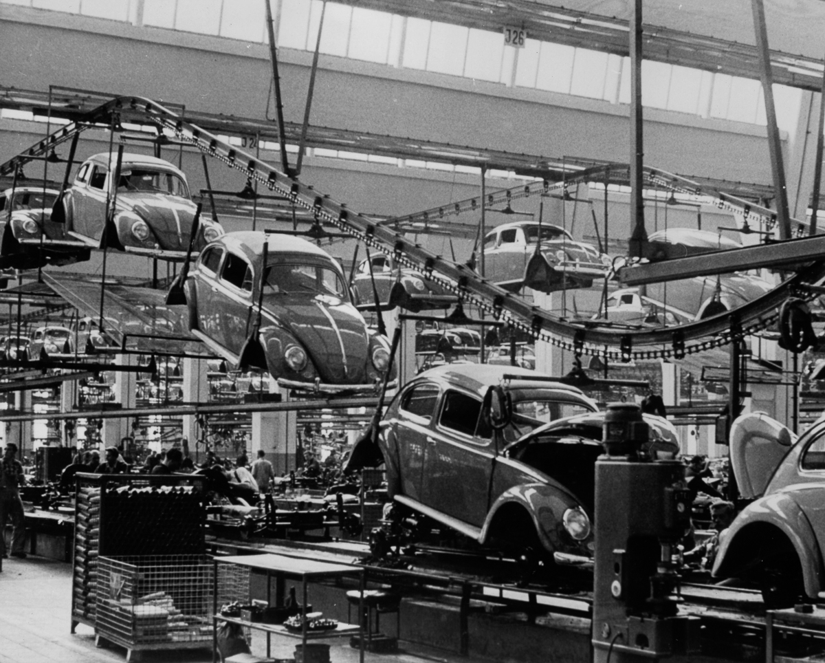 26th September 1956: A production line manufacturing Volkswagen beetles at the factory in Wolfsburg, West Germany. (Photo by Keystone Features/Getty Images)